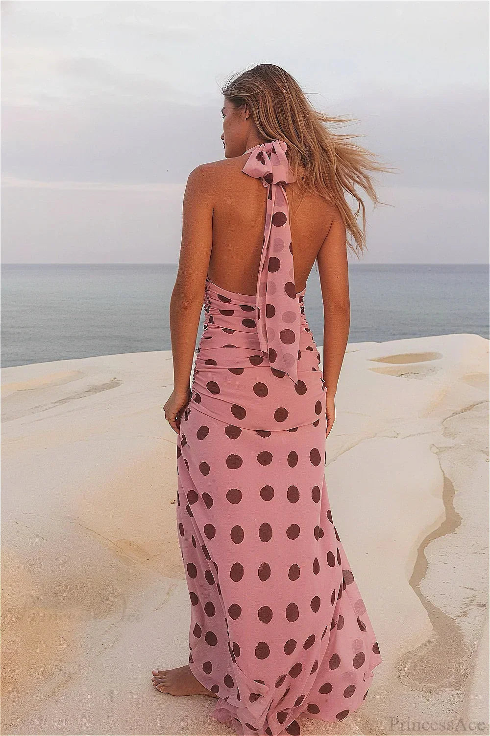 Vestido maxi sin espalda con lazo en la cintura de lunares
